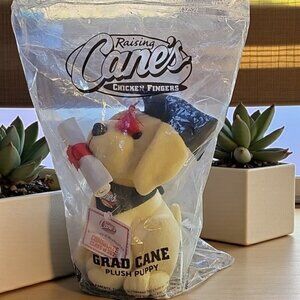 New factory sealed Raising Cane's Grad Cane Plush Puppy